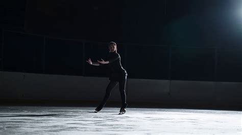Professional Female Ice Figure Skater Practicing Spin On Indoor Skating