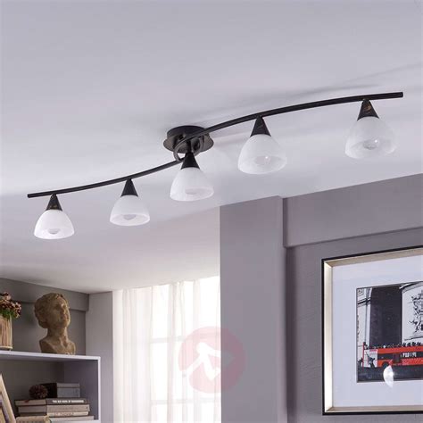 Ceiling lights are the most popular and effective way to illuminate a room, offered in a range of styles to suit both traditional and contemporary décor for functional yet stylish use. 5-bulb LED ceiling light Della, elongated | Lights.co.uk