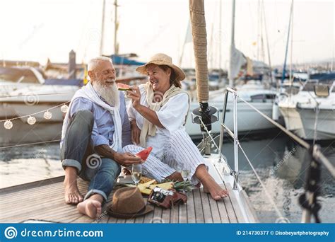 Senior Couple Eating Watermelon On Sail Boat Old People Having Fun