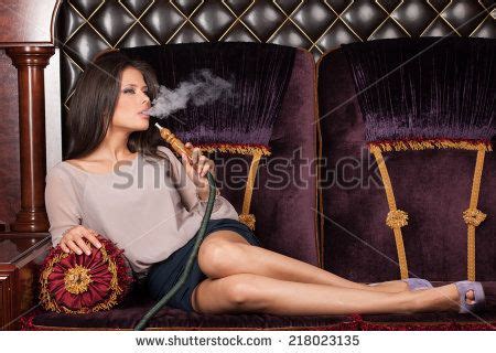Beautiful Babe Woman Inhaling Hookah Girl Smoking Shisha Lying On Sofa In Cafe Stock Photo