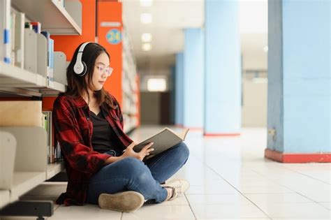 Premium Photo Student In Casual Style Sitting And Reading A Book