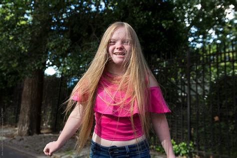 Down Syndrome Girl Smiling By Bowery Image Group Inc