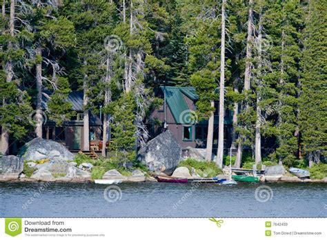 The first bedroom on the main floor has a take in the fantastic view of the pristine waters of fontana lake. Wooden Cabin By Wrights Lake Stock Photos - Image: 7642433
