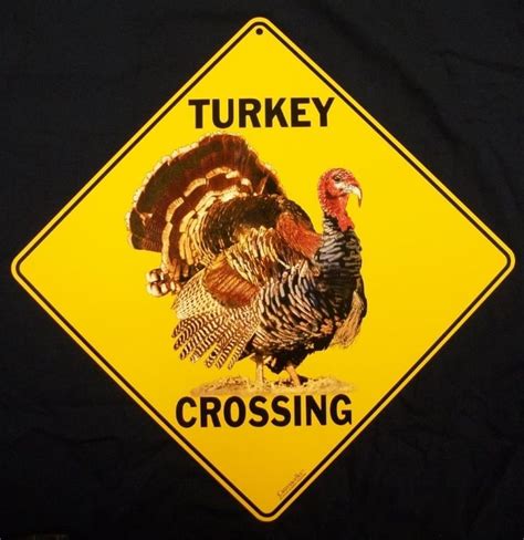 a turkey crossing sign on a black background