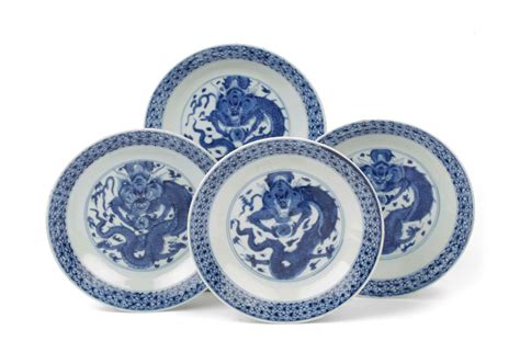 A Set Of Four Chinese Blue And White Dragon Plates