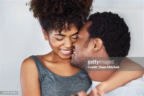 Black Couple Kissing Bed Photos And Premium High Res Pictures Getty Images
