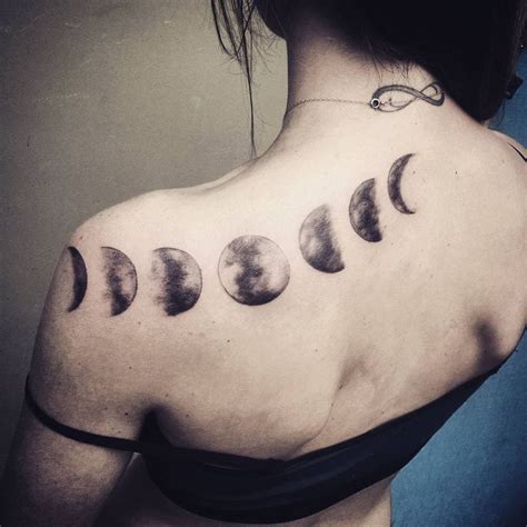 Black Ink Phases Of The Moon Tattoo On Left Back Shoulder Moon Phases