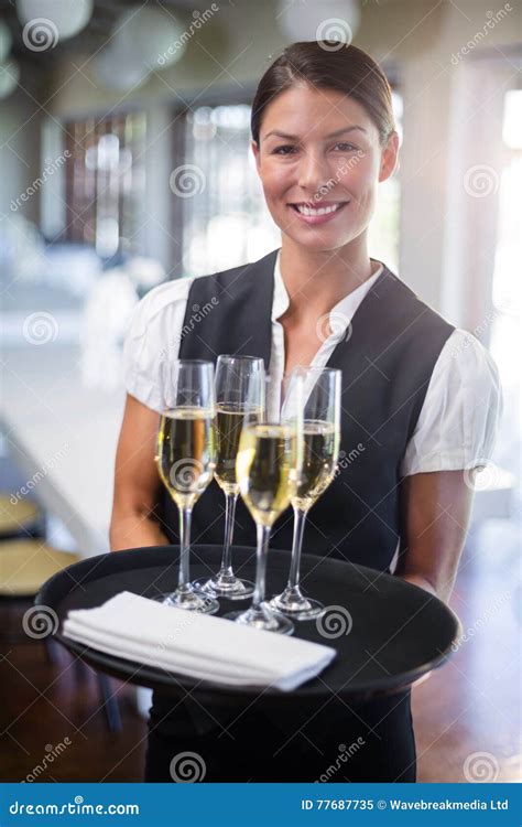 Portrait Of Waitress Holding Serving Tray With Champagne FlutesÂ Stock Image Image Of