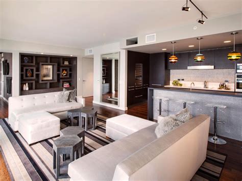 Use it thoughtfully in a neutral and modern color scheme. Living Room & Kitchen with Grey Sofa | HGTV