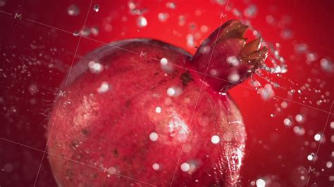 Super Slow Motion Water Drips On Rotating Pomegranate On A Black