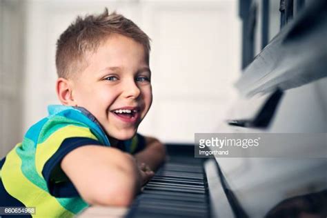 Happy Child Playing Piano Photos And Premium High Res Pictures Getty