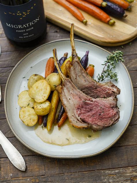 herb roasted rack of lamb recipe couple in the kitchen