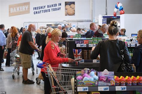 Shoppers Queue In Rain To Be First Into Tescos New Store Jacks