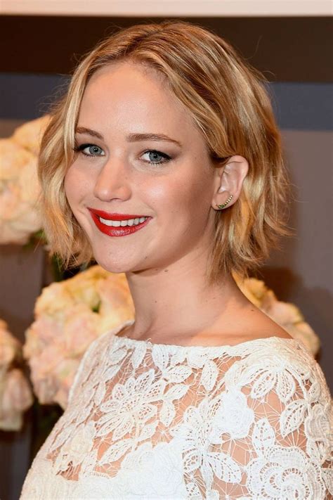 A Close Up Of A Person Wearing A White Dress And Red Lipstick With