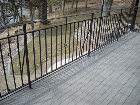 Another popular idea is to apply metal grilles instead of traditional banisters for balcony railing. Metal Deck Railing | Flickr - Photo Sharing!