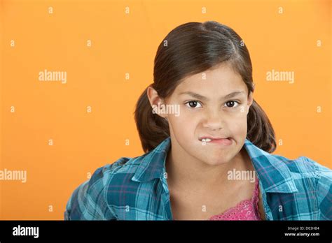 Latina Girl On Orange Background Hi Res Stock Photography And Images