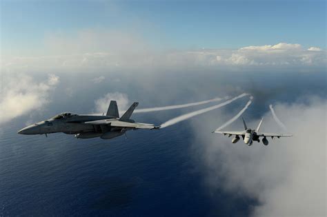 Two Fa 18e Super Hornets From The Tophatters Of Strike Fighter Squadron Vfa 14 Participate In