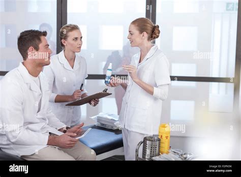 Nurse Educating Young Colleagues Stock Photo Alamy