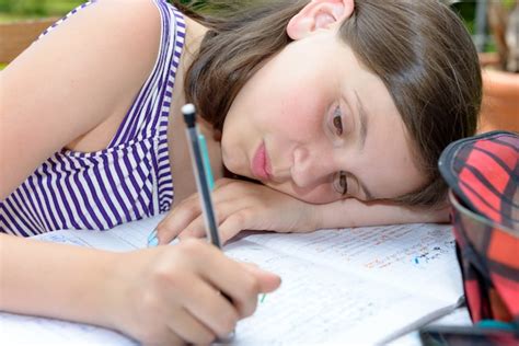 Premium Photo Bored Teenage Girl Is Doing Her Homework