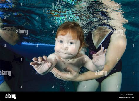 1 Year Old Baby Is Supported Underwater By His Mother Stock Photo Alamy