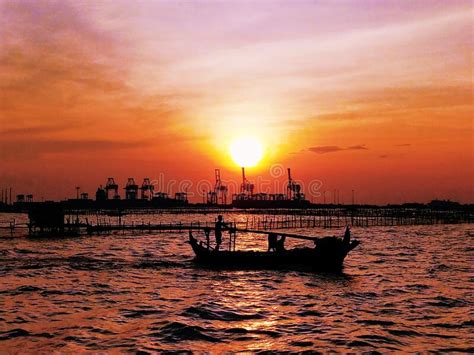 Beautiful Sunset On The Beach In Fishing Village Semarang Stock Photo