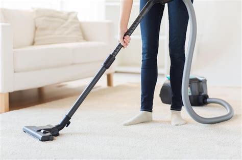 Premium Photo People Housework And Housekeeping Concept Close Up Of Woman With Legs Vacuum