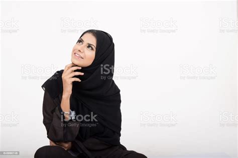 Young Pretty Arab Girl In Traditional Dress Setting On The Floor Stock