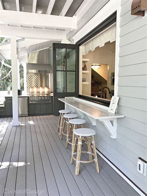Outdoor Bar Area That Opens Into Kitchen Window With Folding Door And