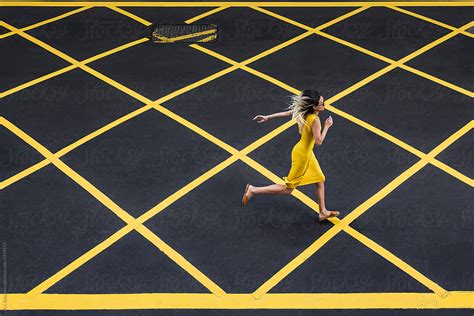 Woman In Yellow Dress Running By Stocksy Contributor Aj Schokora