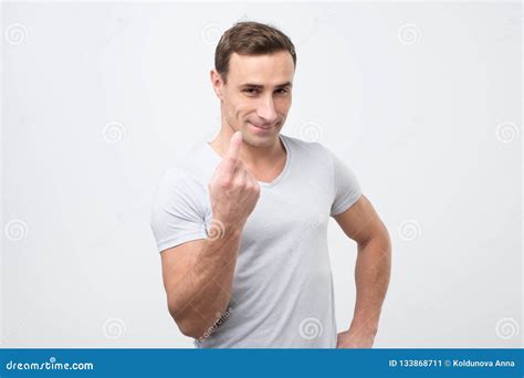 Handsome Young Man Showing Come Here Gesture With Index Finger And