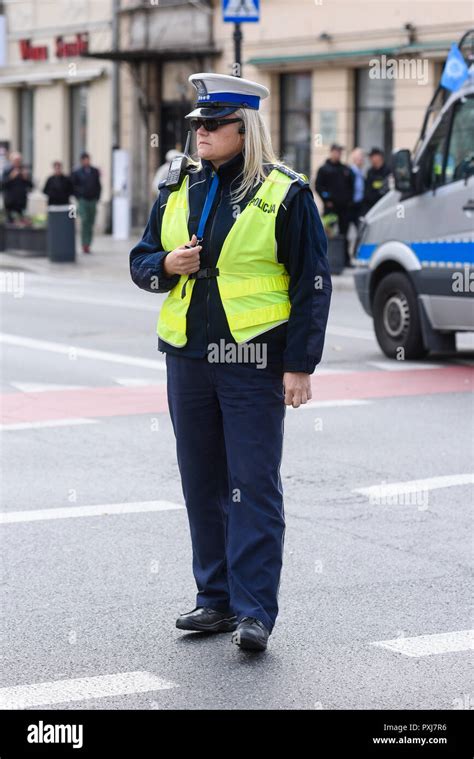 Warsaw Poland October022018 Police Woman Standing On The Cross Road And Controlling The