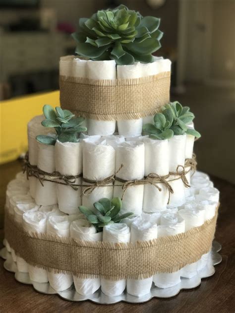 Diaper cakes are popular at baby showers because they double as practical gifts and centerpieces. Succulent/Farmhouse diaper cake, a must have for your ...