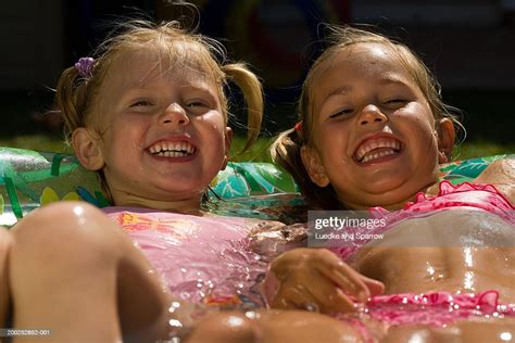 Two Girls Lying In Paddling Pool Laughing Bildbanksbilder Getty Images