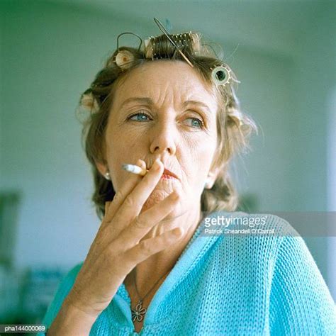 Mature Woman Smoking Cigarette Stock Fotos Und Bilder Getty Images