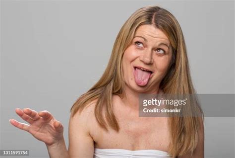 older woman tongue out photos and premium high res pictures getty images