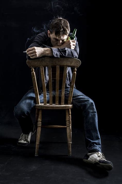 Depressed Man On Chair Smoking Cigarette Stock Photo Image Of