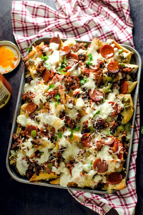 Place under the broiler and keep a close eye on them so that they don't burn. Loaded Pizza Nachos with Creamy Garlic White Sauce - Host ...