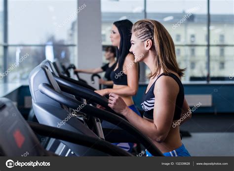 Sexy Fit Women Running On Treadmills In Modern Gym Healthy Young Young Girls Doing Running