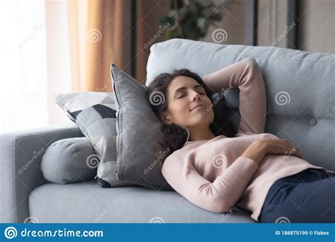 Peaceful Beautiful Woman Sleeping On Cozy Couch In Living Room Stock Image Image Of Beautiful