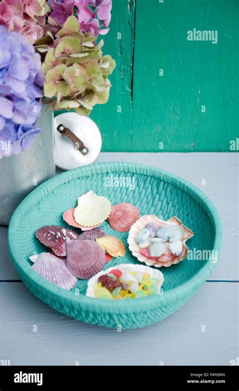 Painted Basket With Shells And Candies Stock Photo Alamy