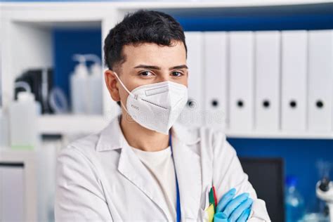 Young Non Binary Man Scientist Wearing Medical Mask At Laboratory Stock