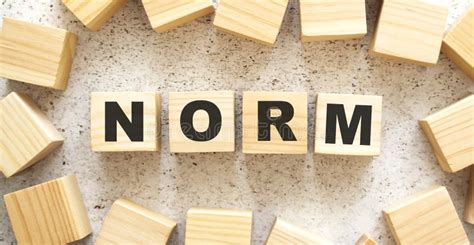 The Word Norm Consists Of Wooden Cubes With Letters Top View On A