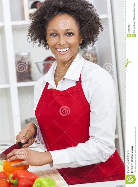 Mixed Race African American Woman Cooking Kitchen Stock