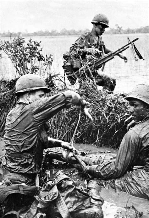 Vietnam War 1st Infantry Division Medic Treating A Wounded Soldier
