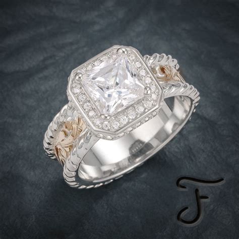 A Diamond Ring With Two Tone Gold And Diamonds On The Band Sitting On