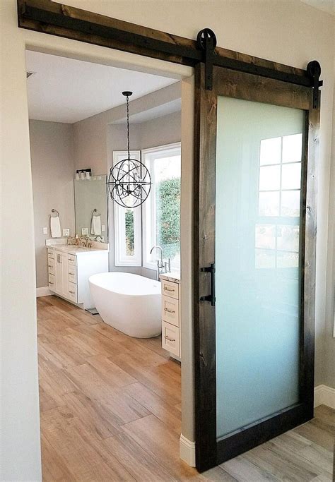 frosted glass knotty alder barn door with hardware for a master bedroom bathroom bathroom barn