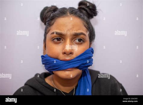Woman With Cloth Wrapped Around Her Mouth Stock Photo Alamy