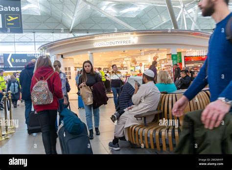 Passengers In Departure Lounge Near World Duty Free Shop Stansted