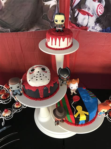 Three Tiered Cakes Decorated With Cartoon Characters On Top Of Each