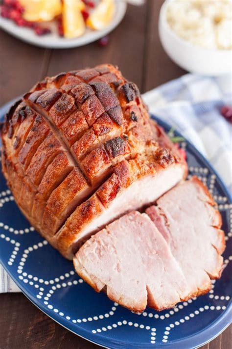 Pour the pineapple juice into the base of the pan and cover the ham with two pieces of foil or parchment paper and bake for 15 minutes. Baked Ham with Brown Sugar Glaze (Video) - A Spicy Perspective